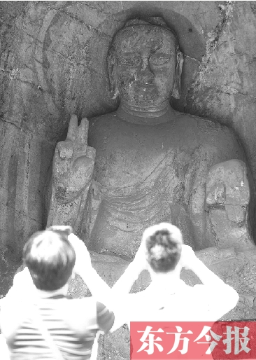 洛陽(yáng)龍門(mén)石窟“剪刀手”佛像走紅 專(zhuān)家稱(chēng)實(shí)屬巧合